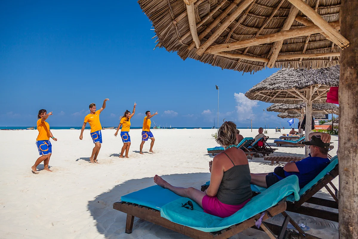 Lively soft-sand beach with sun loungers at Kendwa, Zanzibar