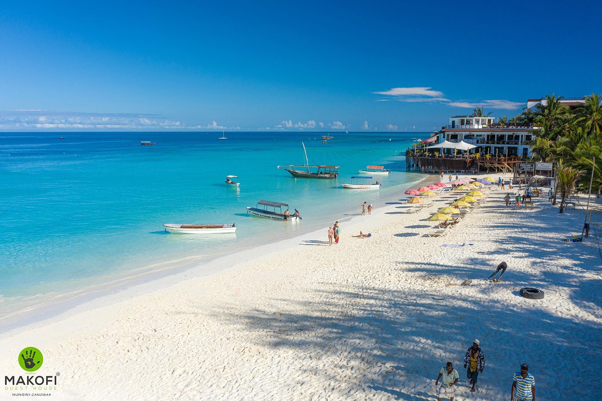 White sand, turquoise water and boats on Nungwi beach, north Zanzibar