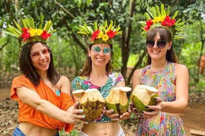 Happy guests with coconuts and flower crowns on a Zanzibar spice farm tour