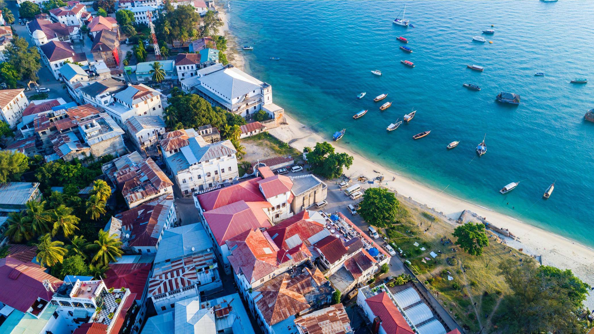 Historic Stone Town waterfront with wooden boats in Zanzibar
