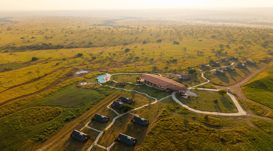 Aerial view of a luxury permanent safari lodge at the vast landscapes of Tanzania’s Serengeti.