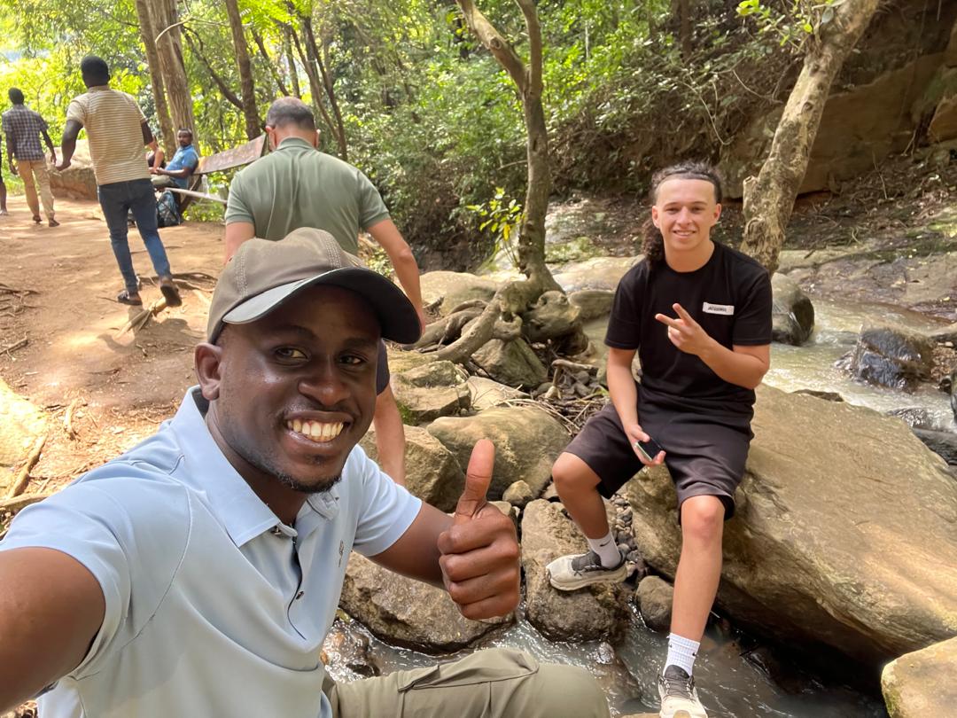 Guide and traveler at the Choma Waterfalls in the Uluguru Mountains