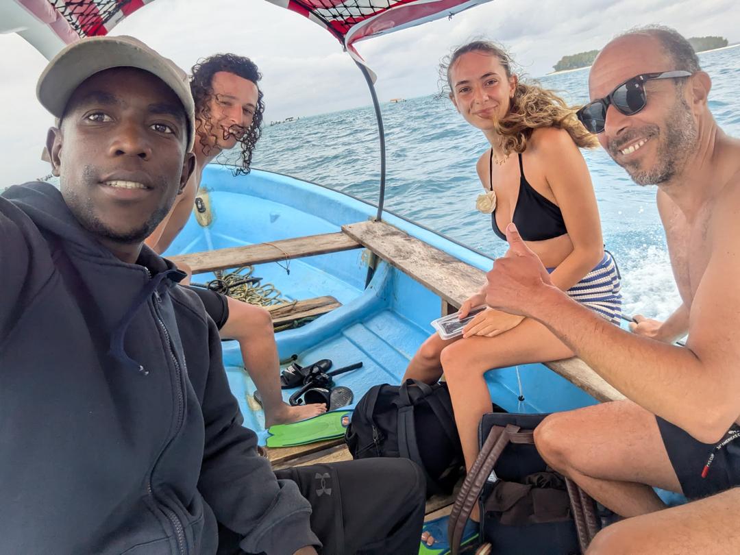 The Kai Tours Guider with the Guests on Boat at Mnemba Atoll.