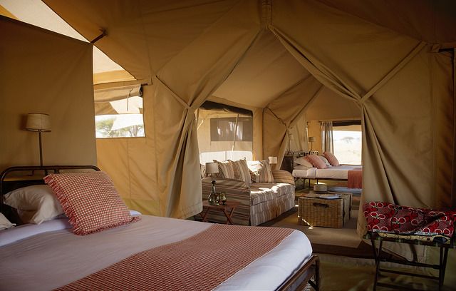 The inside view of safari tented camps showing it's bedrooms.